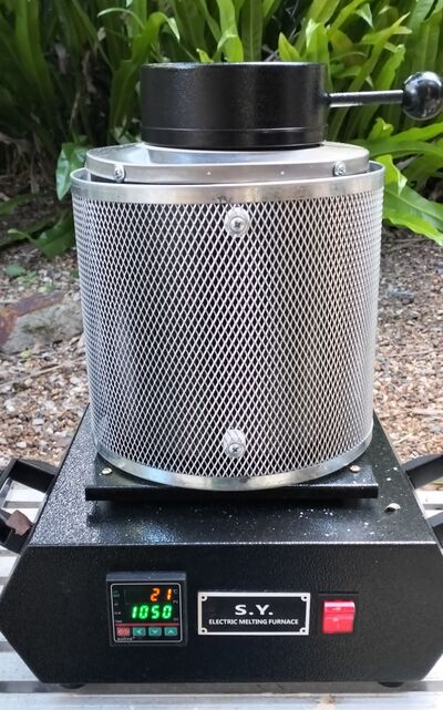 The compact electric furnace ready to bring brass and bronze stock up to casting temperature