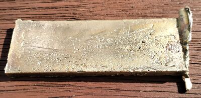 A cleaned view of the first brass ingot, turning scrap and failed work back into usable workshop stock